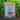 Brown box of Bio-Live fertilizer in a lush garden bed.