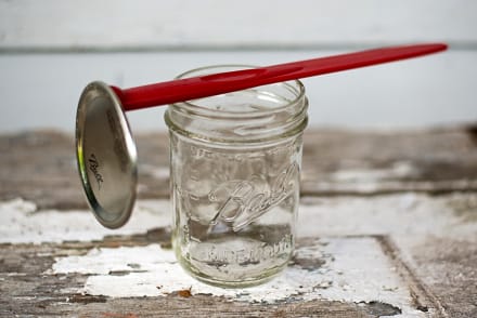 Red canning tool for opening can lids and removing bubbles